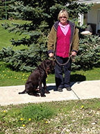 Karen posing with Rick who is a German Wirehaired Pointer